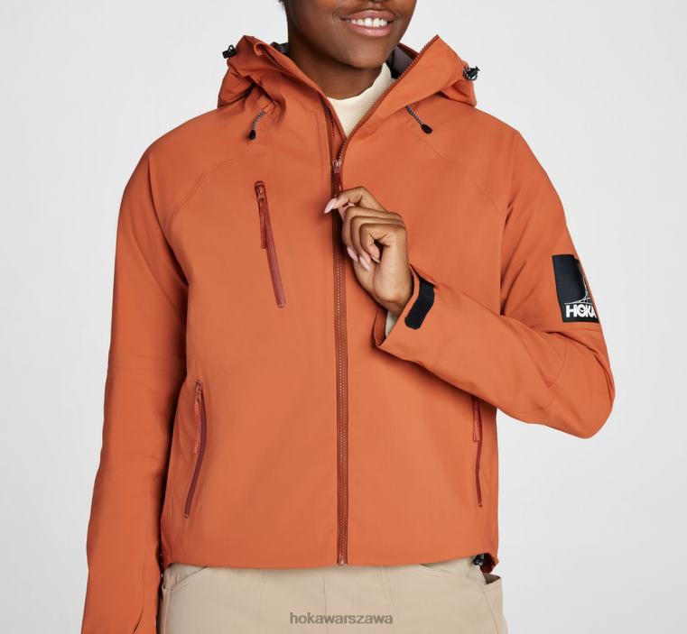 transportową kurtkę przeciwdeszczową Hoka L0PVV373 kobiety pieczona glina